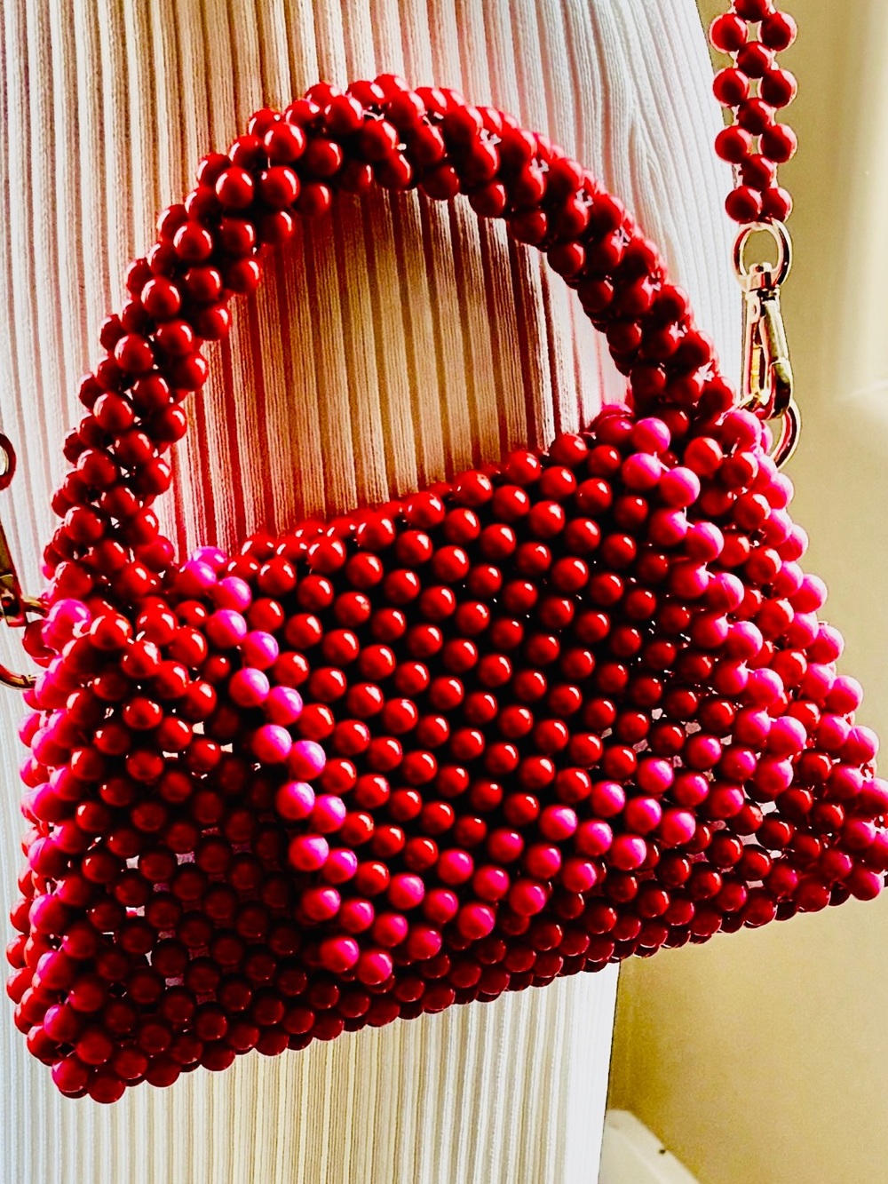 Kate Spade Beaded Red and Pink Handbag, heavy.
Dress sold separately